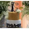  Silhouettes of couple subject to wedding cake